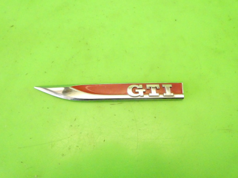 Listewka logo znaczek emblemat GTI lewy przód VW GOLF VII 12-16 Listewka logo znaczek emblemat GTI lewy przód VW GOLF VII 12-16