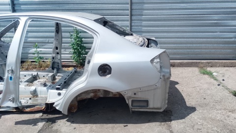 Błotnik lewy tył tylny poszycie Z2S SUZUKI SX4 I GY RW SEDAN 06-09